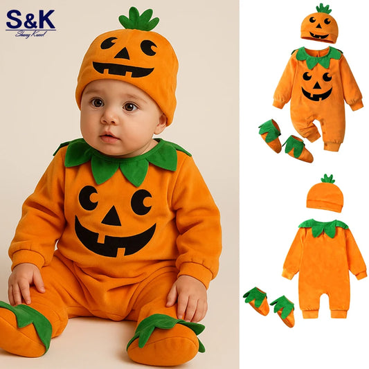 Baby in a Halloween pumpkin costume with matching hat, shoes, and romper on a beige background.